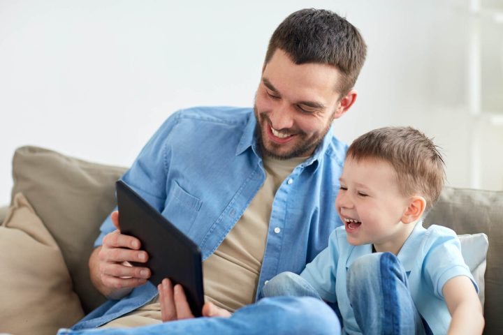 father-and-son-with-tablet-pc-playing-at-home-2024-09-28-03-46-16-utc.jpg